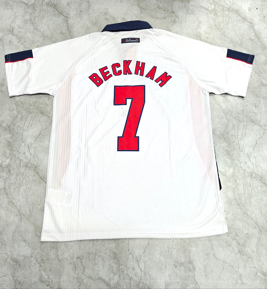White sports jersey with 'Beckham' and number '7' on a gray textured background